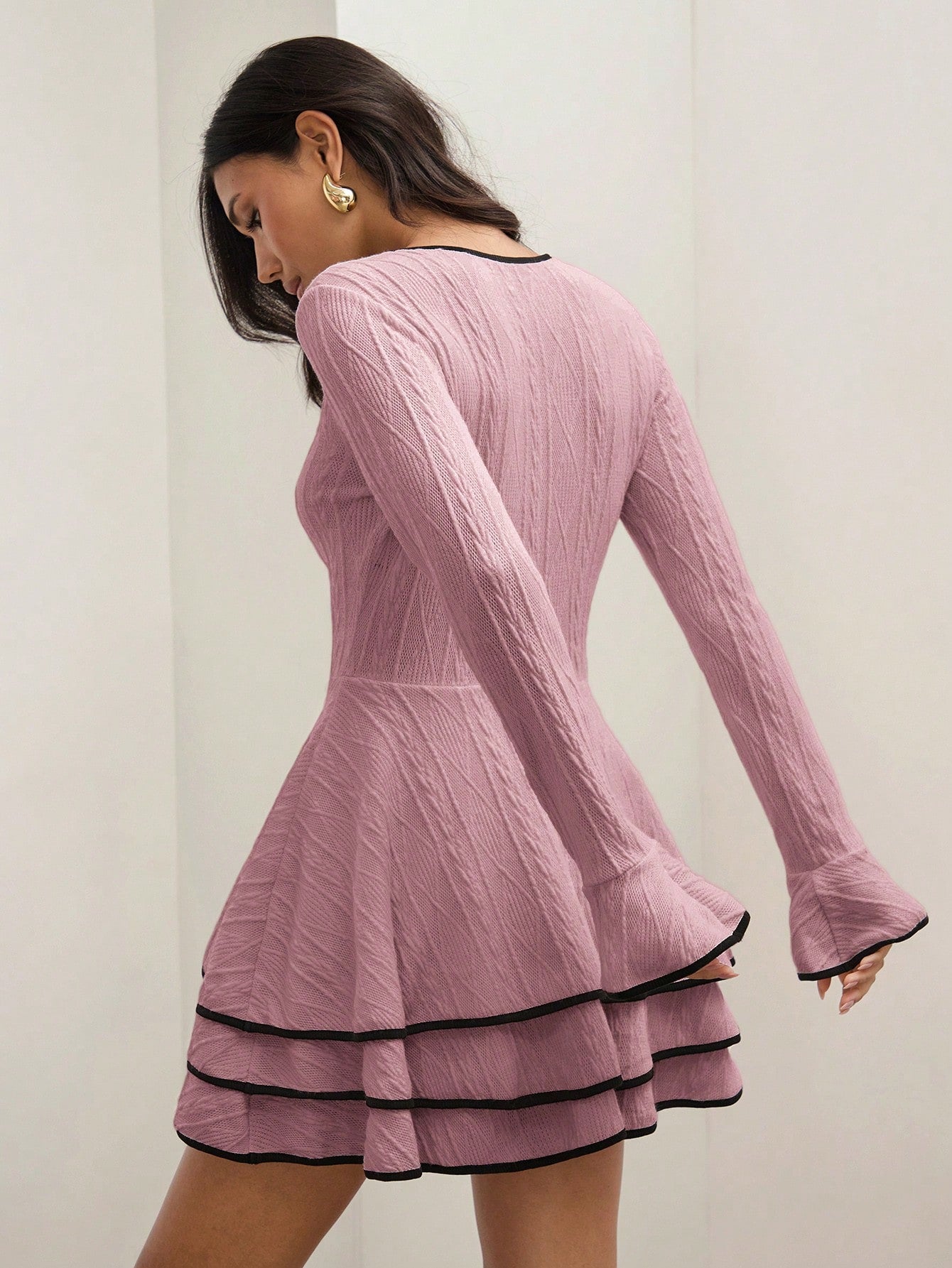 Stay cozy and stylish with our Chic Elegance Dress, perfect for Fall & Winter. This casual dress features patchwork trim and a layered hem for a unique touch. Dress it up or down for any occasion.