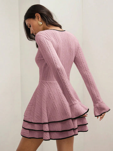 Stay cozy and stylish with our Chic Elegance Dress, perfect for Fall & Winter. This casual dress features patchwork trim and a layered hem for a unique touch. Dress it up or down for any occasion.