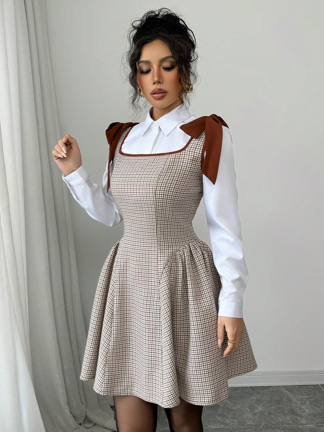 Add a touch of chic elegance to your wardrobe with the Elenzga Plaid Dress. Designed with contrast straps and a cute bow, this dress is perfect for any occasion. Stay stylish and comfortable with the soft fabric and flattering silhouette. (Bow down to fashion!)