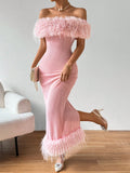 Elevate any occasion with our Chic Elegance: Furry Splice Off-Shoulder Dress. The luxurious fur detail and off-shoulder design add a striking touch to your look. Make a statement with this elegant dress, perfect for any formal event or night out.