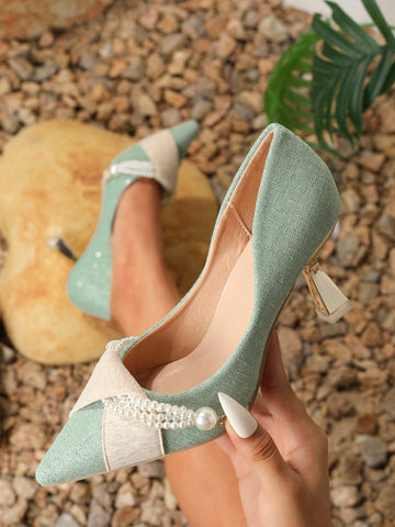 Crafted with sophistication, these Chic Elegance high-heeled shoes feature a stunning faux pearl chain detail that adds a touch of elegance to any outfit. Made for the fashion-forward woman, these shoes will elevate your style with every step.