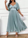 Expertly designed for plus size figures, this Chic Elegance midi dress exudes sophistication with its pleated design and deep V-neck. The ruched sleeves add a touch of glamour while highlighting your curves. Perfect for any occasion, this dress offers both style and comfort.