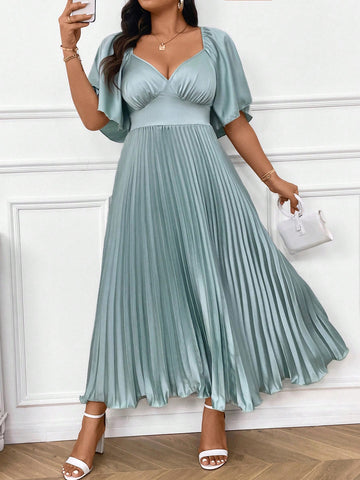 Expertly designed for plus size figures, this Chic Elegance midi dress exudes sophistication with its pleated design and deep V-neck. The ruched sleeves add a touch of glamour while highlighting your curves. Perfect for any occasion, this dress offers both style and comfort.