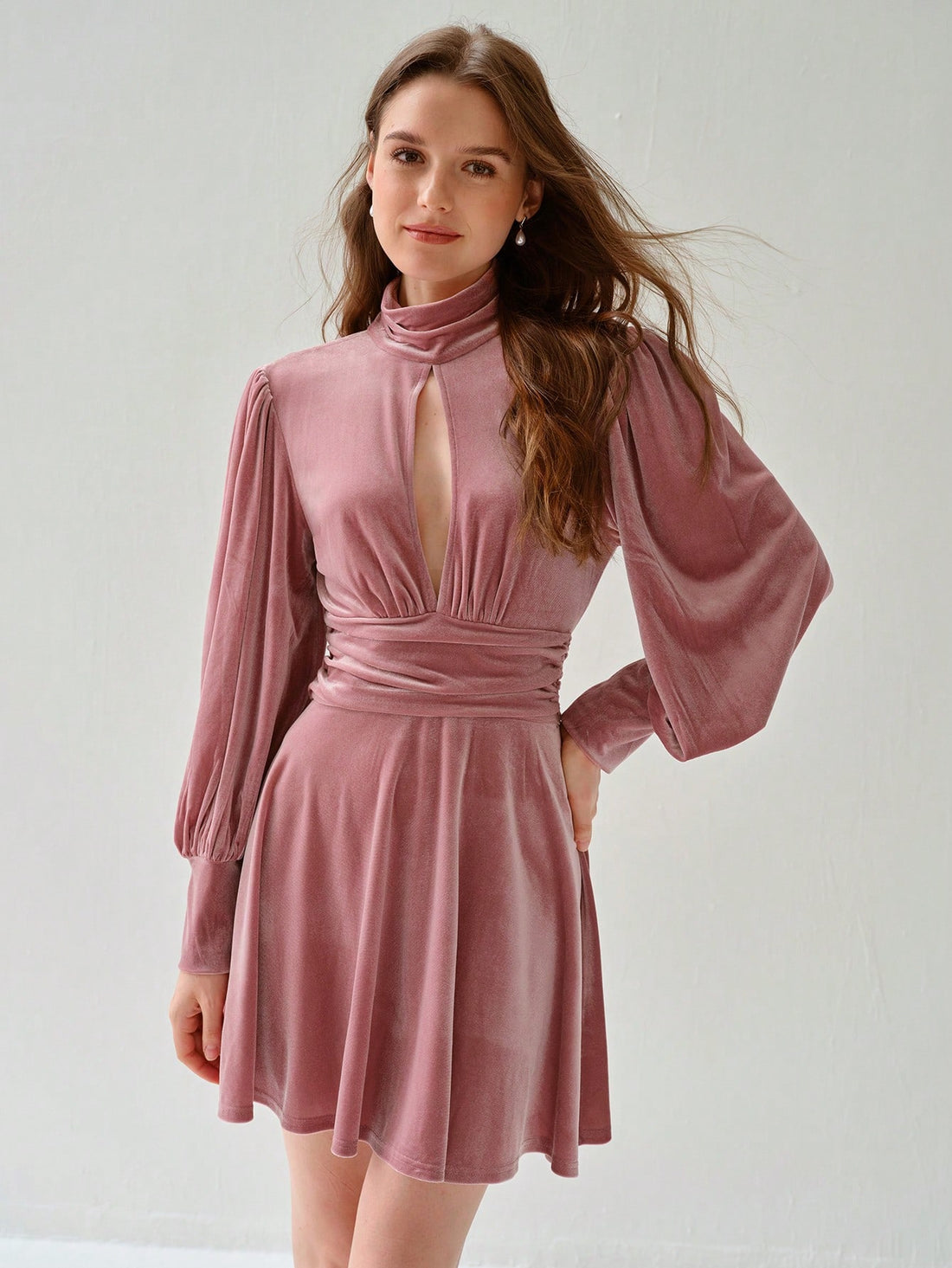 Introducing our Chic Elegance dress, a stylish option for women seeking a stand-out look. The solid color and pleated design add a touch of sophistication, while the stand collar and long sleeves provide a unique twist. Perfect for any occasion, this dress exudes charm and elegance.