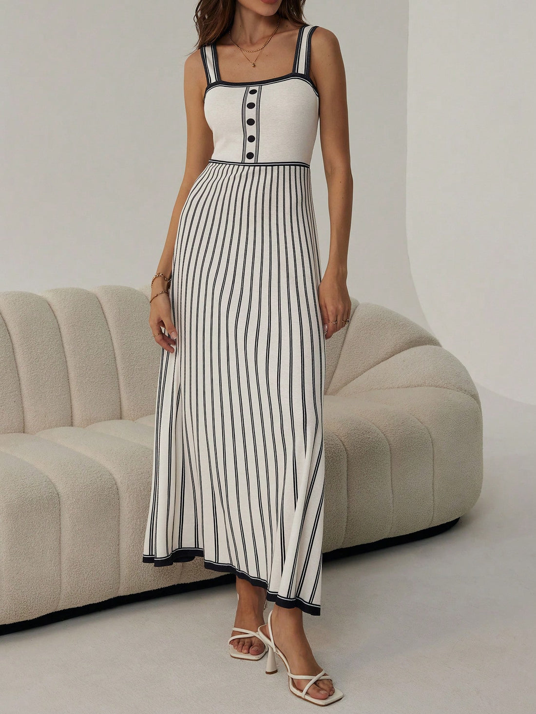 Effortlessly transition from work to dates to summer outings with our Chic & Elegant Color Block Striped Long Slip Dress. The perfect combination of style and versatility, this dress will elevate your wardrobe. Make a statement with its bold stripes and feel comfortable all day with its slip design.