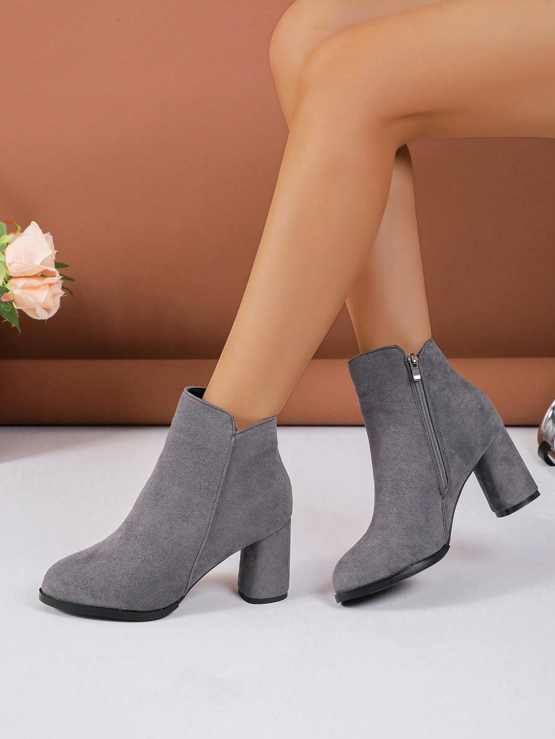 Stride confidently in these chic and elegant ankle boots! Featuring a pointed toe, chunky heel, and side zipper, these suede boots are perfect for any fashionable woman. Slip into these beauties and elevate your style game! (Plus, they'll make your feet feel like they're on cloud nine!)