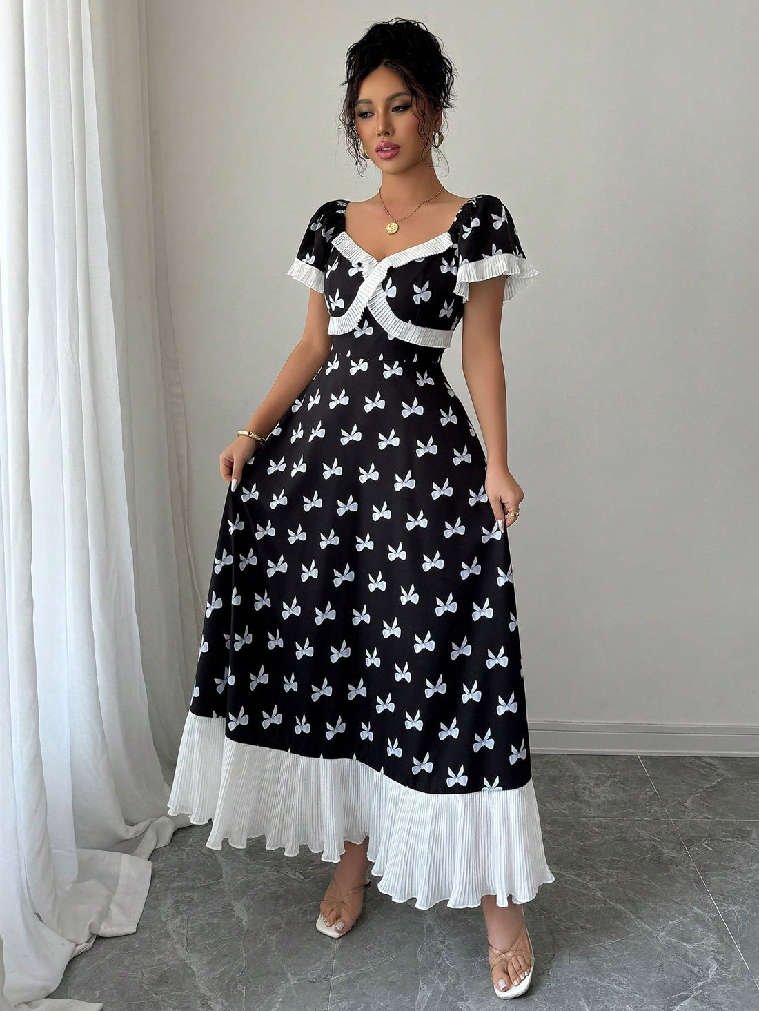 Make a statement in our Elenzga Pleated Ruffle Collar Swing Dress! This sassy number features eye-catching contrasting colors and a playful ruffle collar that's sure to turn heads. The flattering swing silhouette dances with your every move, while pleated details add a touch of whimsy. Dress it up or down—this versatile piece is ready to be your go-to for brunches, parties, or wherever your fabulous life takes you!