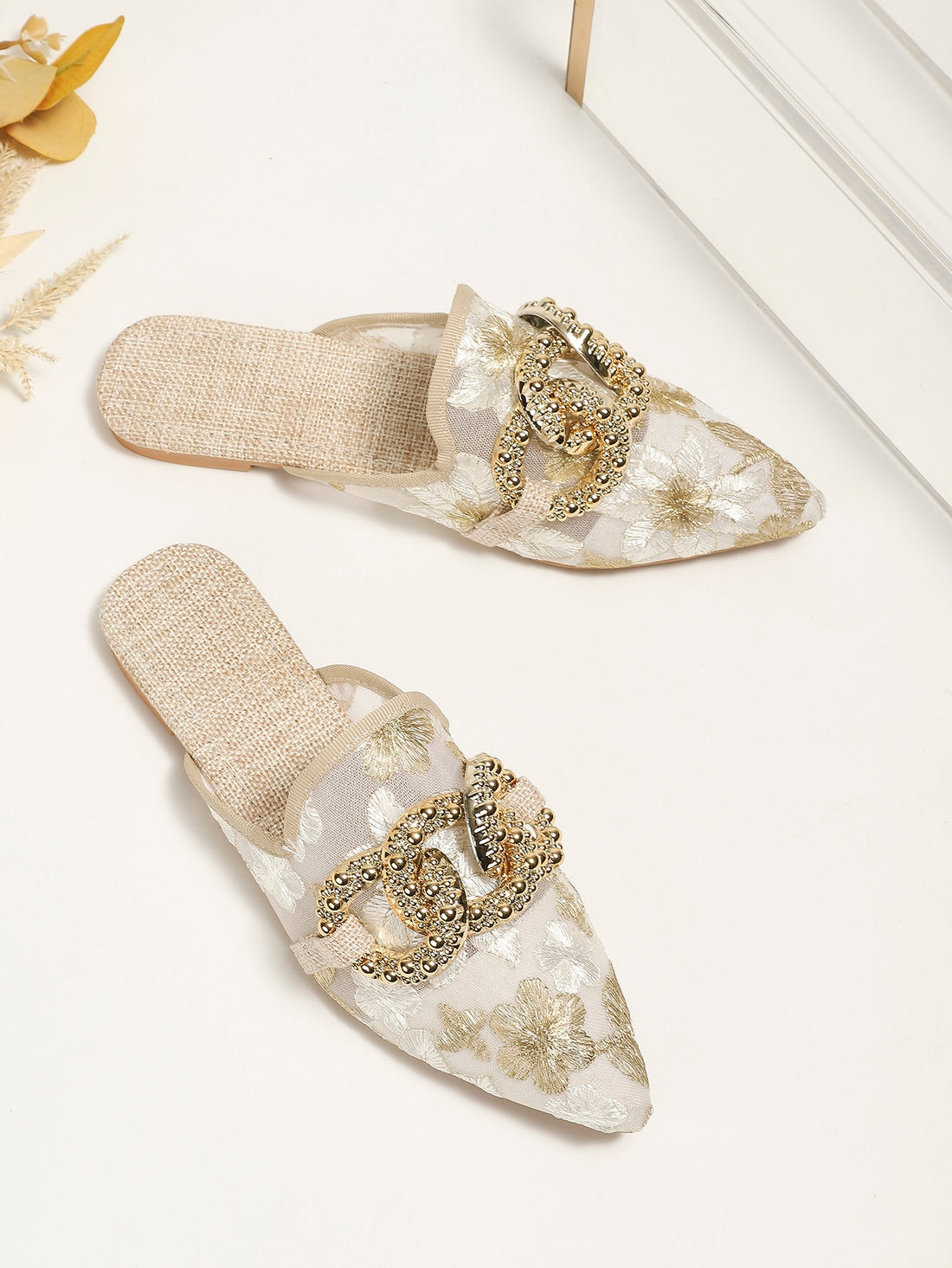 These chic sandals feature elegant embroidered mesh detailing and a statement metal buckle for a stylish and unique look. The breathable design provides comfort and the sturdy metal buckle ensures durability. Elevate your summer wardrobe with these fashionable flat sandals.