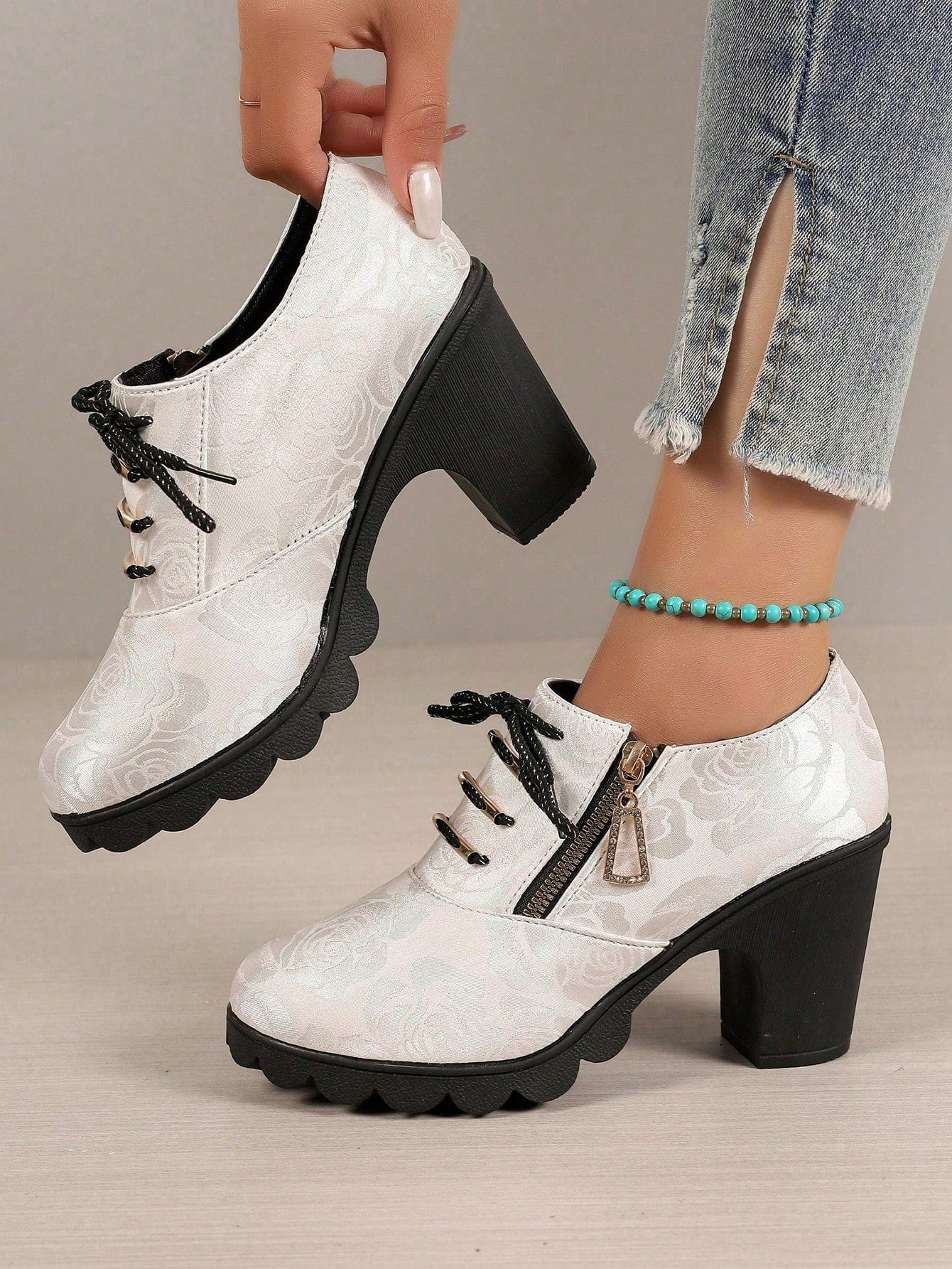 Elevate your style with these chic European-inspired rhinestone high-heeled boots. Featuring a stylish zipper and lacing, these boots add a touch of elegance to any outfit. With a comfortable heel height and secure fit, these boots are both fashionable and practical. Step out in confidence and style with these must-have boots.