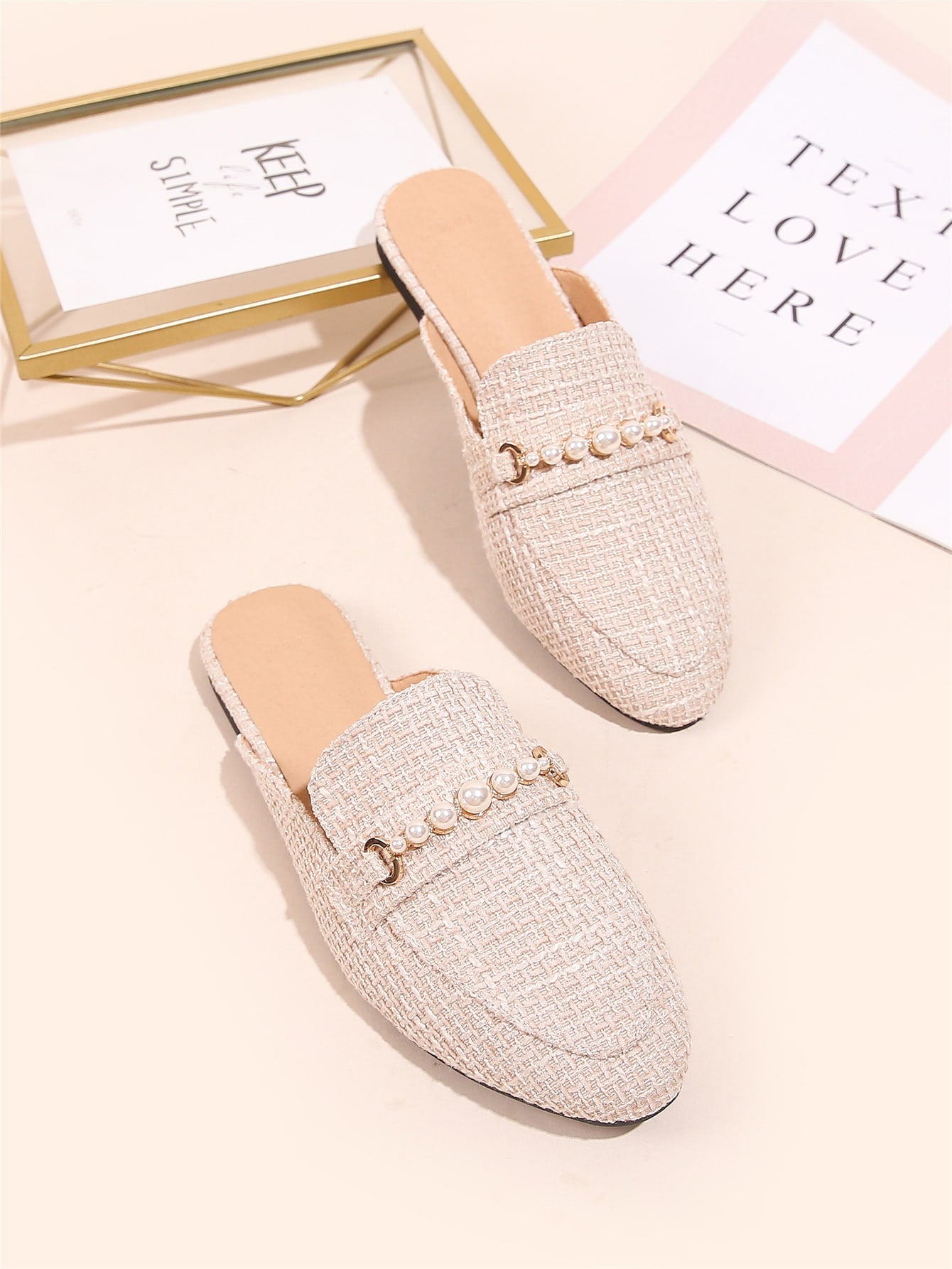 Slip into effortless elegance with these charming loafer mules, adorned with lustrous faux pearl details that catch the light beautifully. Designed for the cooler months, they transition seamlessly from casual outings to special occasions—think cozy coffee dates or romantic dinners. The relaxed mule silhouette offers all-day comfort without sacrificing style, while the pearl embellishments add that perfect touch of sophistication. Whether you're treating yourself or surprising someone special, these versati