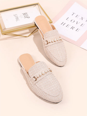 Slip into effortless elegance with these charming loafer mules, adorned with lustrous faux pearl details that catch the light beautifully. Designed for the cooler months, they transition seamlessly from casual outings to special occasions—think cozy coffee dates or romantic dinners. The relaxed mule silhouette offers all-day comfort without sacrificing style, while the pearl embellishments add that perfect touch of sophistication. Whether you're treating yourself or surprising someone special, these versati