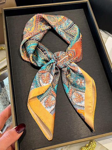 Elevate your style with this chic faux silk scarf, featuring an elegant paisley floral print that adds sophistication to any outfit. Versatile and lightweight, it works beautifully as a hair accessory, waist wrap, or neck scarf. The smooth faux silk fabric drapes gracefully and feels luxurious against the skin. Perfect for adding a pop of color and texture to casual or dressed-up looks. A timeless piece that complements any wardrobe.