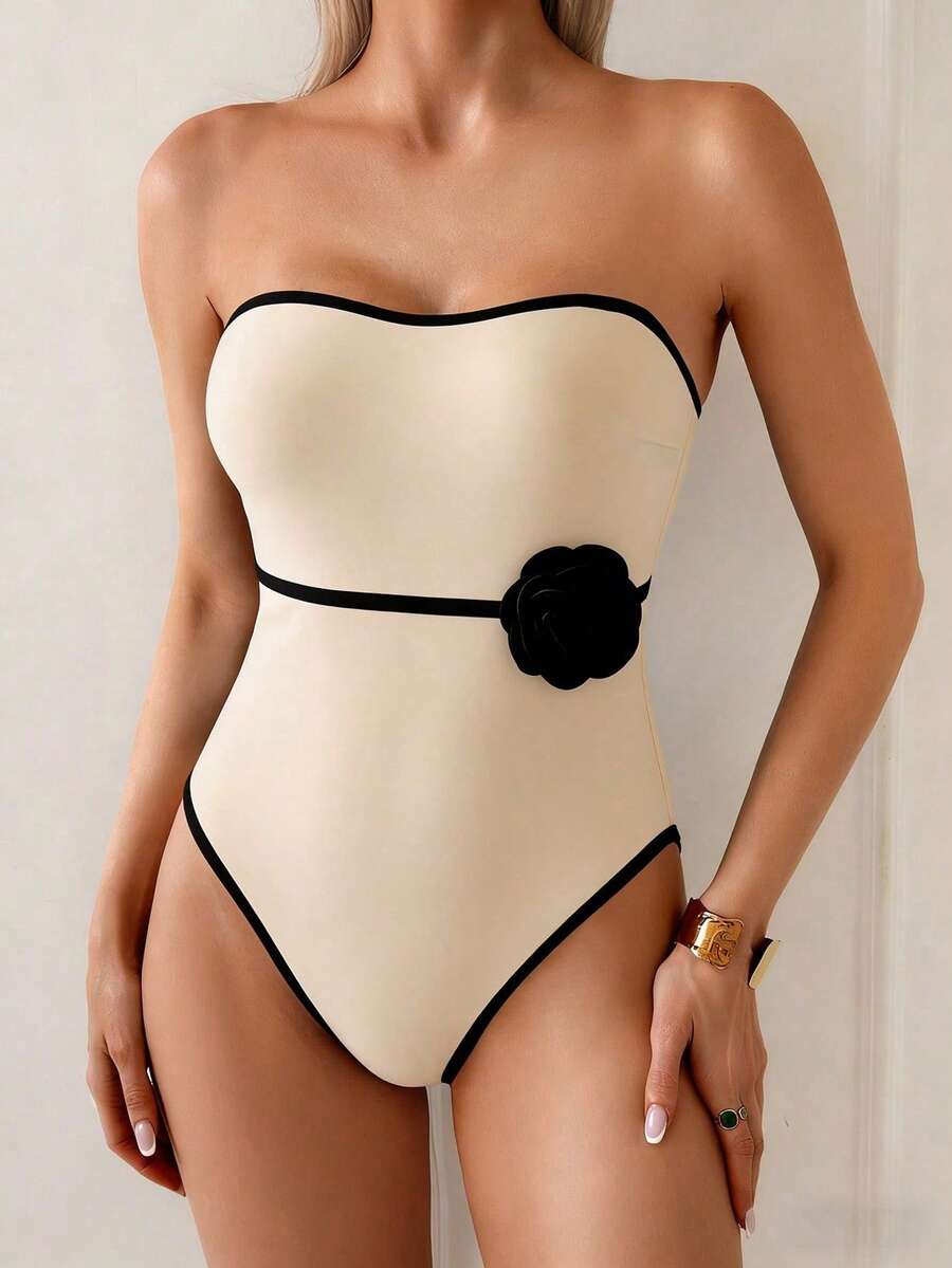 Embrace timeless elegance with this chic floral one-piece swimsuit, designed for the modern woman who values both style and comfort. The convertible strapless design offers versatile styling options—wear it strapless for a sleek look or add straps for extra support. Crafted with vintage-inspired details, this swimsuit features a flattering silhouette that celebrates your curves while providing reliable coverage and comfort for all-day beach wear. 