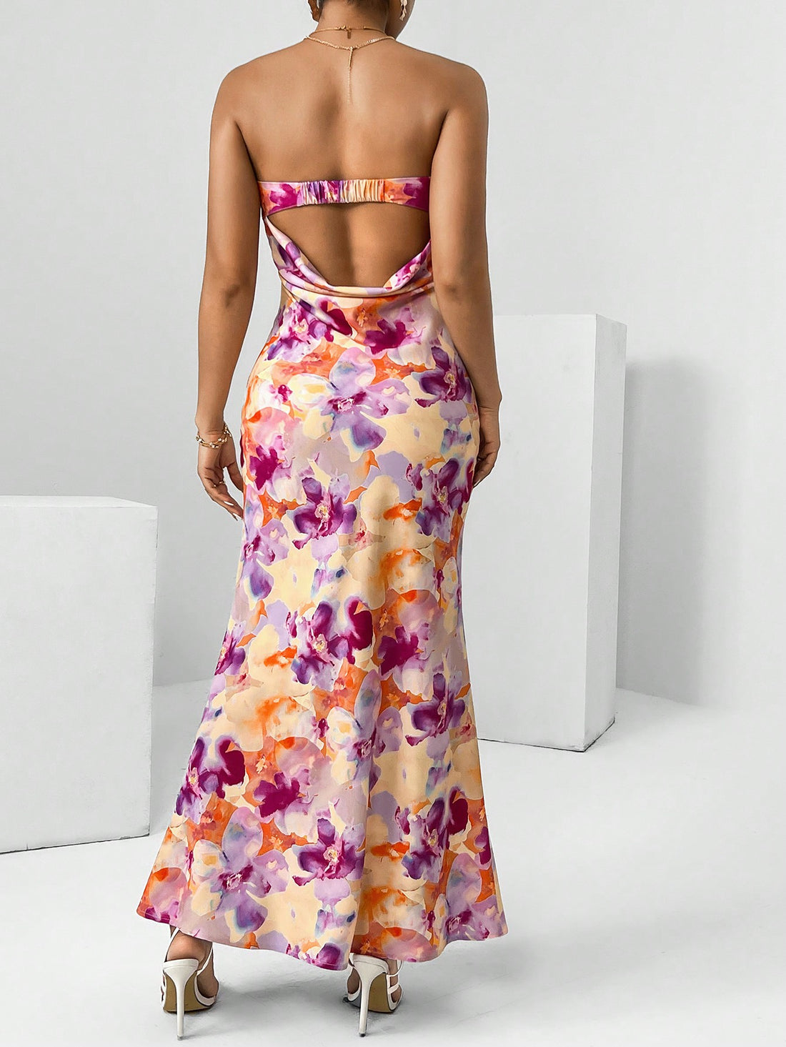 Get ready to bloom this Spring Break with our Chic Floral Draped Backless Tube Dress! This flowy and flirty dress is the perfect addition to your vacation wardrobe. Its unique draped back design adds a touch of playfulness, making it perfect for any sunny adventure. (Limited quantities available!)
