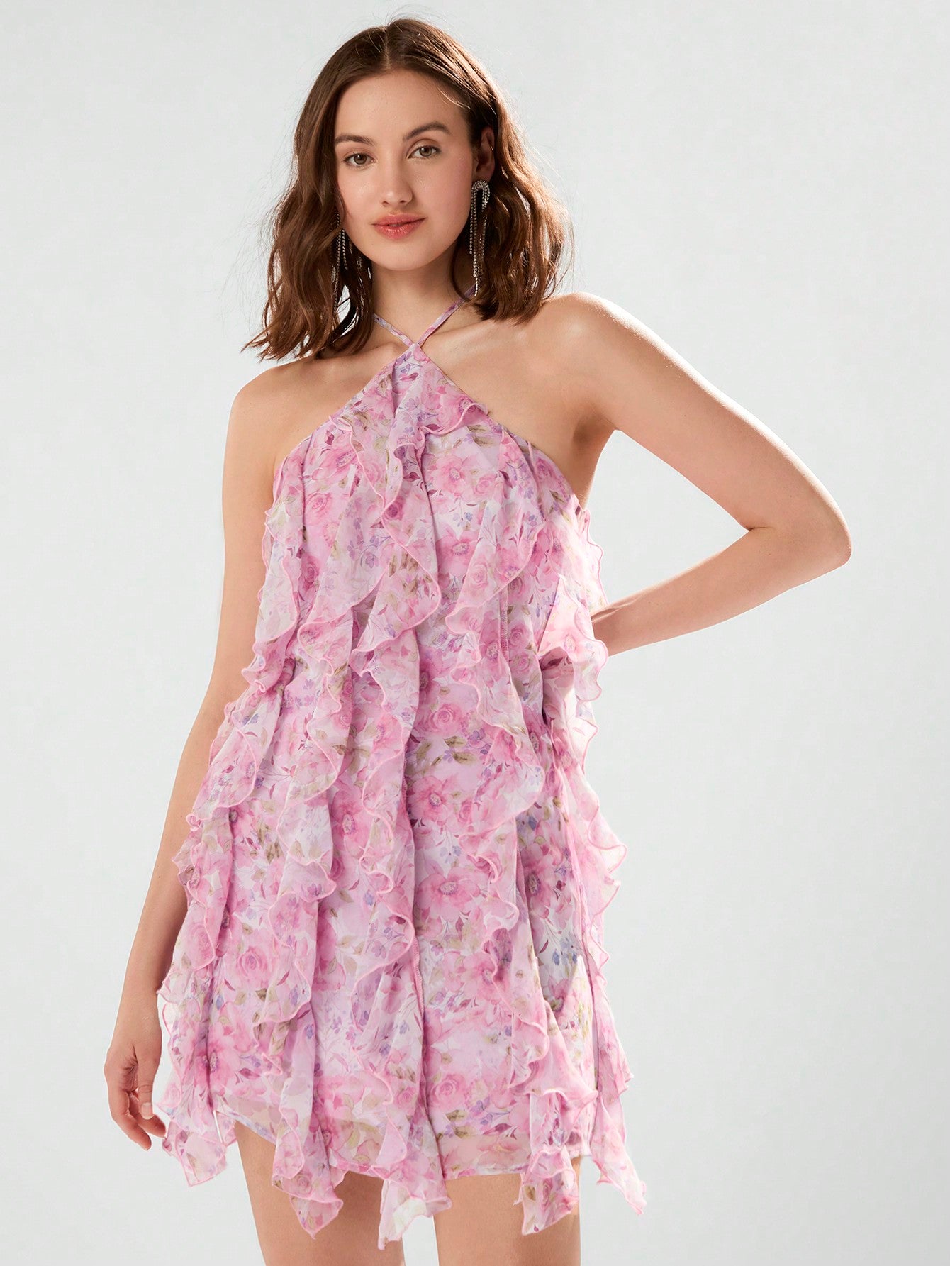 Turn heads with this chic floral halter dress! The draped ruffle design adds a playful touch to the perfect summer fashion piece. Stay stylish and comfortable all season long.
