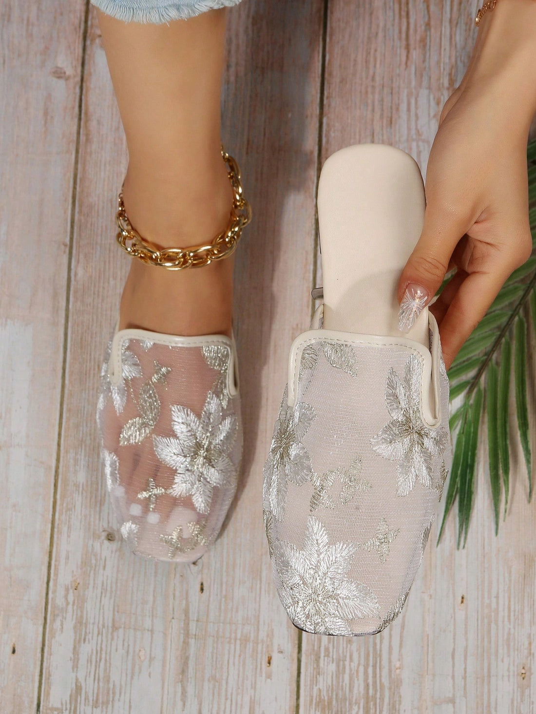 Introducing the Chic Floral Embroidered Mesh Panel Flat Mules - the perfect addition to your wardrobe. These stylish mules feature a delicate floral embroidery and mesh panel design, bringing effortless style to any outfit. With a flat sole, they provide both comfort and fashion-forward appeal. Upgrade your look with these chic mules today.