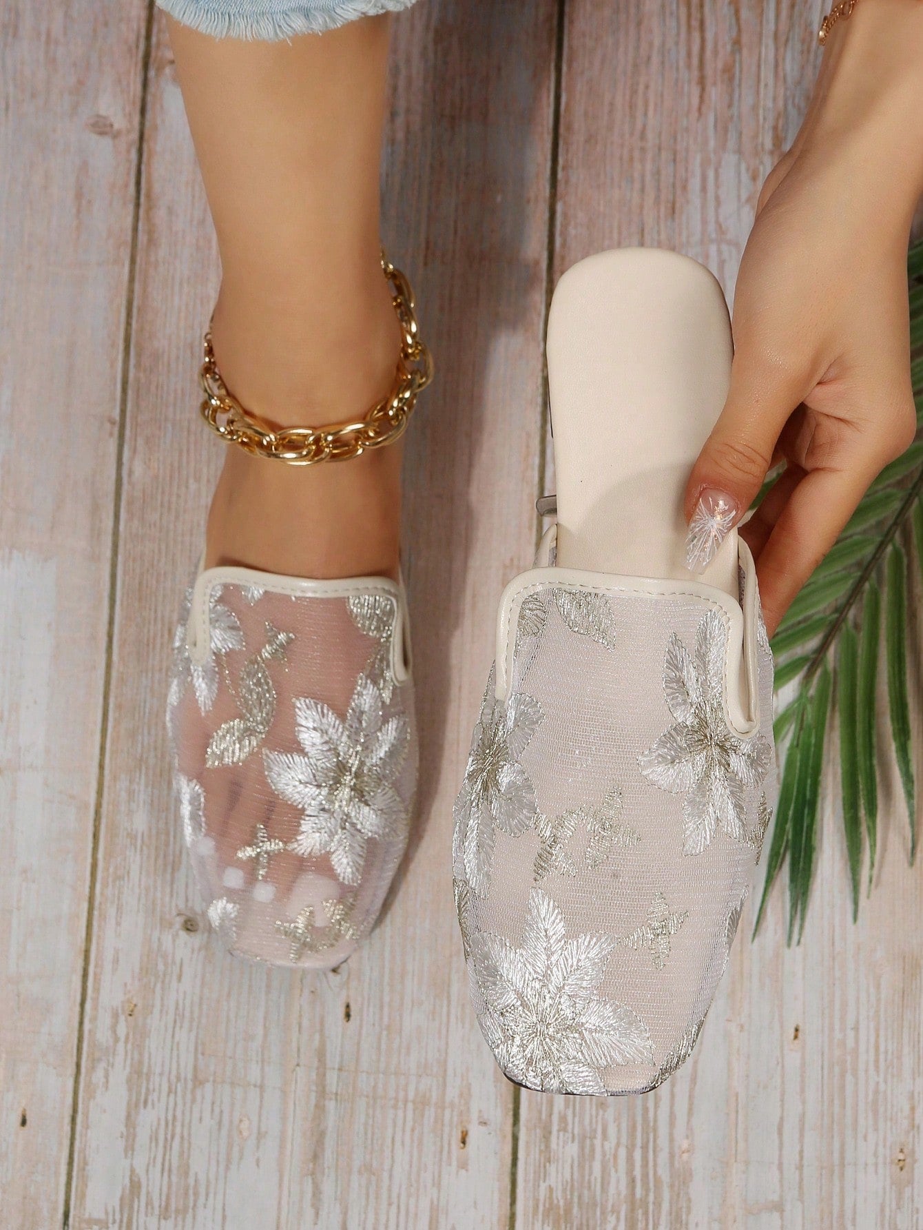 Introducing the Chic Floral Embroidered Mesh Panel Flat Mules - the perfect addition to your wardrobe. These stylish mules feature a delicate floral embroidery and mesh panel design, bringing effortless style to any outfit. With a flat sole, they provide both comfort and fashion-forward appeal. Upgrade your look with these chic mules today.