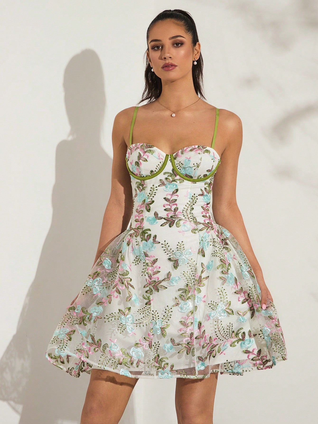 Step into sunshine with this playful floral embroidered mini dress featuring supportive underwire for a flattering fit. Its delicate embroidery and breezy silhouette make it an ideal choice for garden parties or sunny vacations, combining comfort with chic style effortlessly.