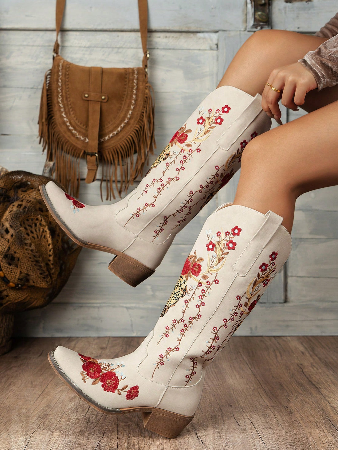 Elevate your style and comfort with our Chic Floral Embroidered Slip-On Wedge Boots! These versatile and trendy boots feature beautiful floral embroidery that adds a touch of elegance to any outfit. Slip them on for a comfortable and fashionable look that will take you anywhere.