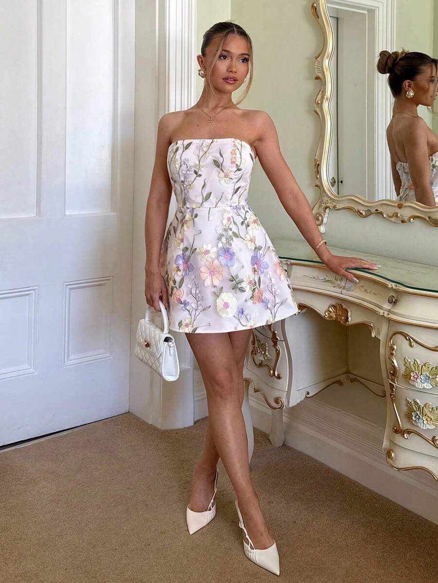 Turn heads at every summer soirée in this stunning floral embroidery bodycon mini dress. Delicate botanical details dance across the fitted silhouette, creating an effortlessly romantic vibe perfect for garden parties and intimate date nights. The form-fitting design flatters your curves while the intricate embroidery adds an elegant touch that sets you apart. Whether you're sipping cocktails under the stars or strolling through blooming gardens, this dress delivers the perfect blend of chic sophistication 