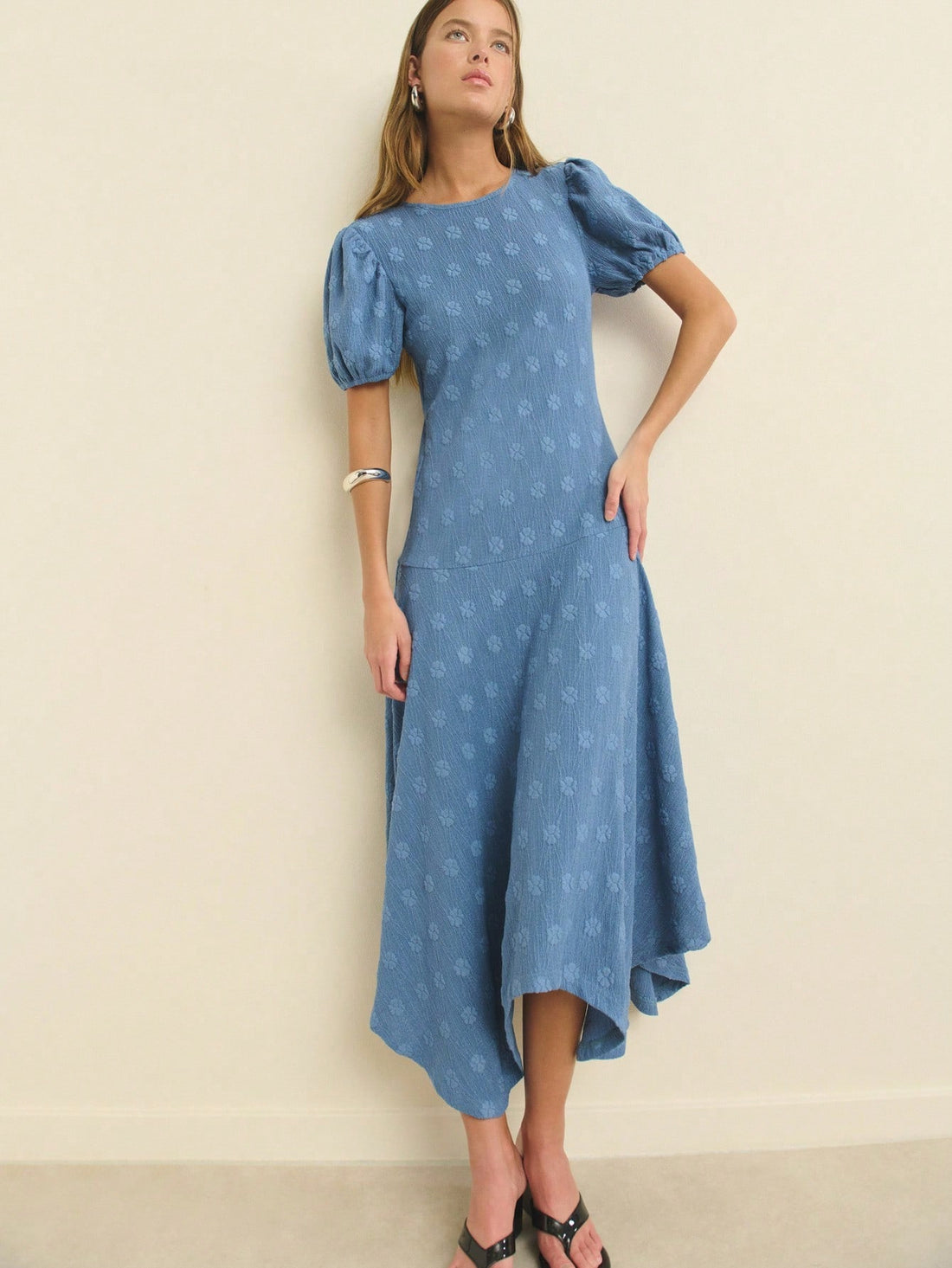 Twirl into summer with this charming floral fit-and-flare dress that's as fun as it is flattering. The delicate puff sleeves add a touch of whimsy while the lightweight fabric keeps you cool during beach days, casual outings, or pride celebrations. The fitted bodice flows into a graceful skirt that moves with you, creating an effortlessly chic silhouette. Whether you're soaking up sunshine or celebrating with friends, this dress brings color, comfort, and personality to every occasion.