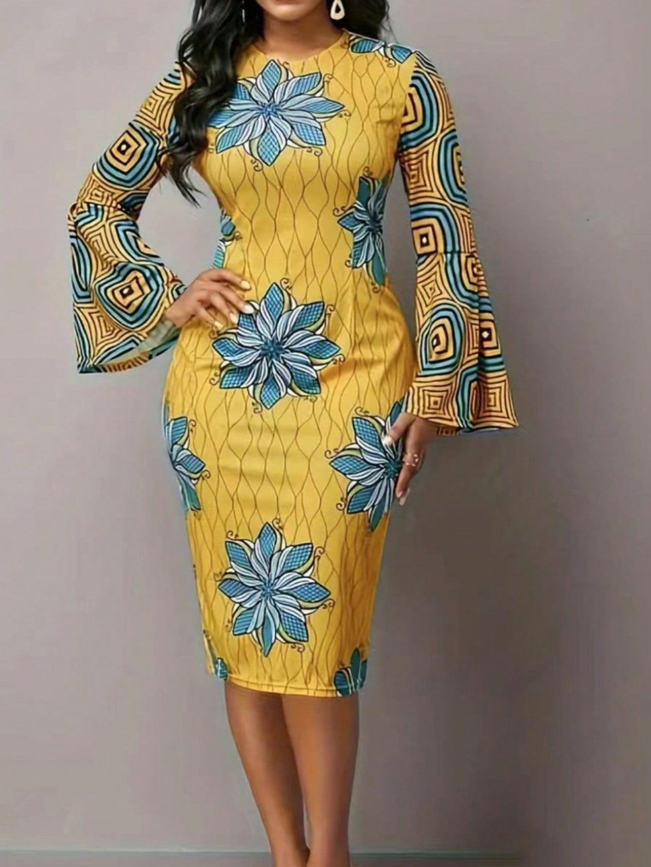 Effortlessly elevate your appearance with our Chic Floral Geometric Print Bell Sleeve Dress. The unique print and bell sleeves add a touch of elegance, perfect for any occasion. With its effortless style, you'll be turning heads and feeling confident all day long.