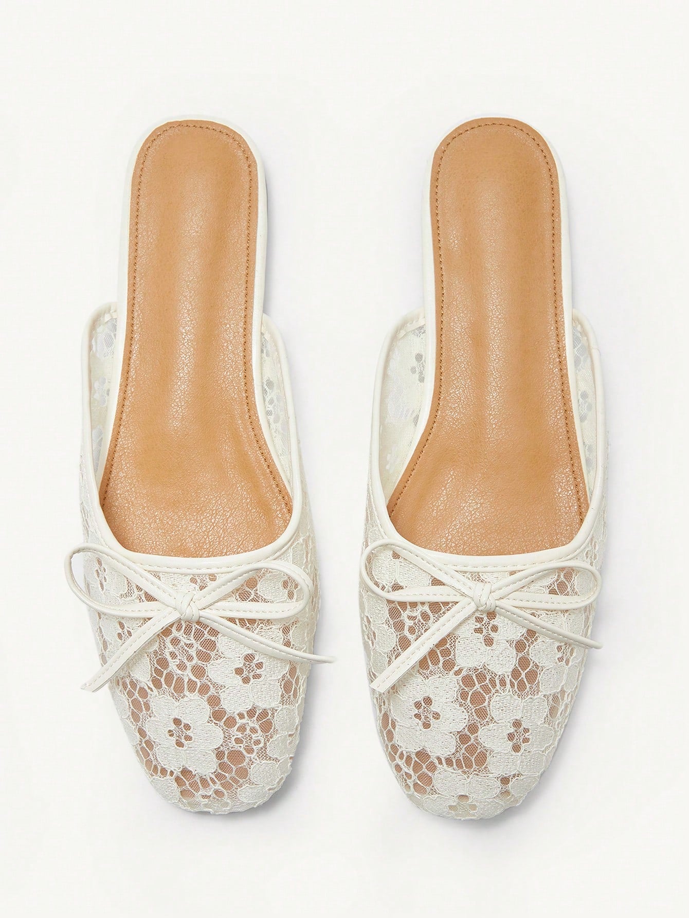 Step into elegance with these charming Mary Jane flats, where delicate floral lace meets timeless style. The sweet bow accent adds a playful touch perfect for spring strolls or holiday celebrations. Designed for all-day comfort, these versatile flats transition seamlessly from casual outings to special occasions. Whether you're dressing up a sundress or pairing with your favorite jeans, these beauties bring a dash of feminine flair to any wardrobe. A must-have for anyone who loves classic style with a moder