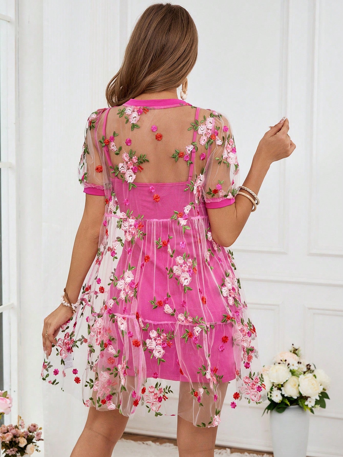 Effortlessly elegant never looked so good! This Chic Floral Mesh Dress adds a touch of whimsy to your everyday wardrobe. Featuring delicate floral mesh and a flattering fit, this dress is perfect for any occasion. Feel stylish and carefree with every wear.