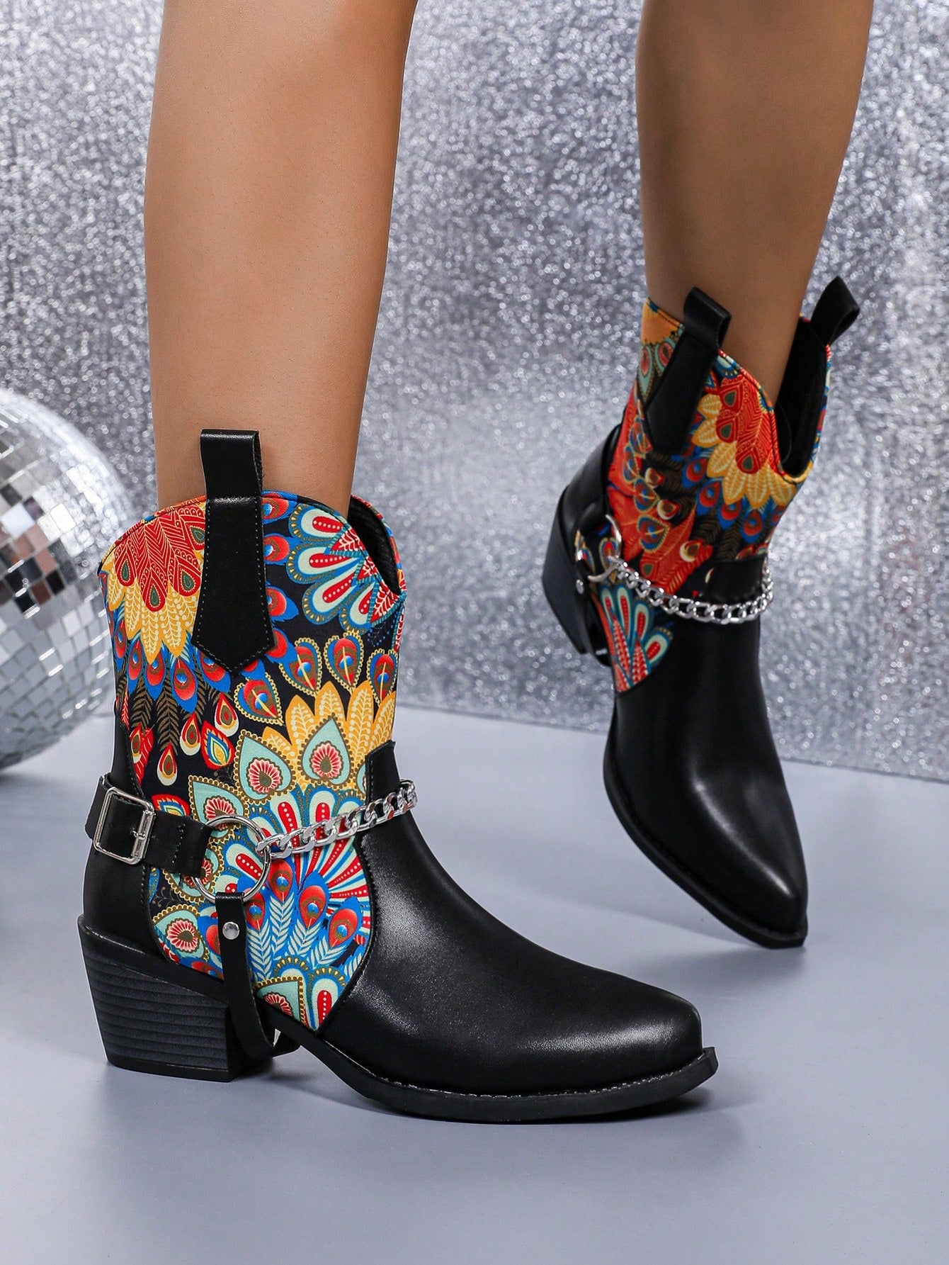 Introducing our chic and stylish Floral Patchwork Western Ankle Boots! These boots feature a unique combination of floral patterns and sturdy block heels, making them a standout addition to any outfit. The metal buckle adds a touch of edginess to the design. Elevate your style with these fashionable boots.