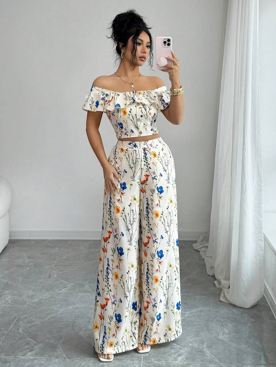 Elevate your wardrobe with this stunning floral print 2-piece set designed for modern sophistication. The ruffle crop top features delicate detailing and a flattering silhouette, while the high-waist wide-leg pants create an elongated, graceful line. Perfect for brunch dates, casual outings, or weekend adventures, this coordinated set delivers effortless elegance without compromising on comfort. The vibrant floral pattern adds a touch of femininity and charm to any occasion.