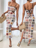 Cream multicolor crochet-look cutout midi dress front and back view with black trim and tie-back detail