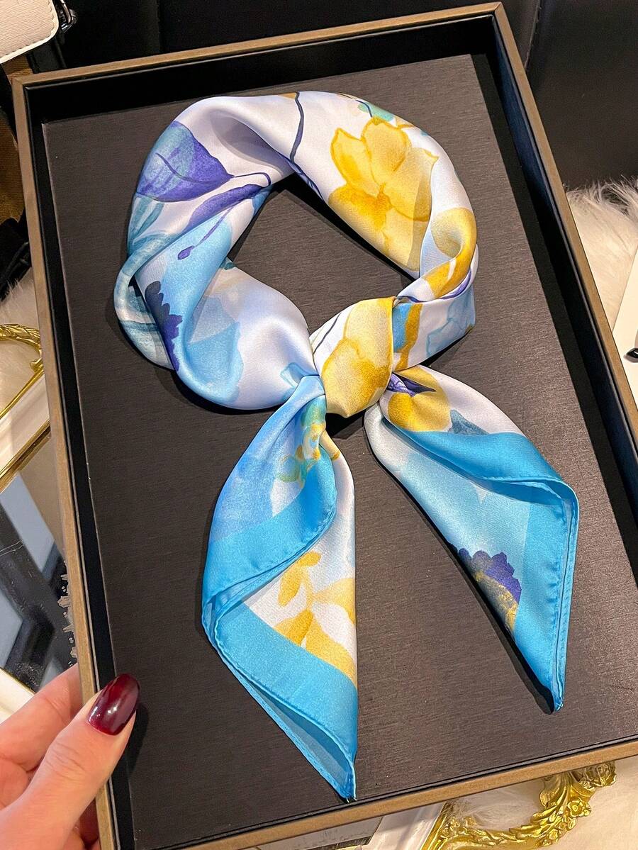 Elevate your spring and summer wardrobe with this stunning floral print faux silk scarf. Featuring vibrant botanical designs, this versatile accessory effortlessly transitions from casual daytime looks to sophisticated evening styles. The lightweight faux silk fabric drapes beautifully, offering a luxurious feel without the premium price tag. Wear it as a headscarf, neck wrap, or tie it to your handbag for an instant style boost. Perfect for adding color and dimension to any outfit
