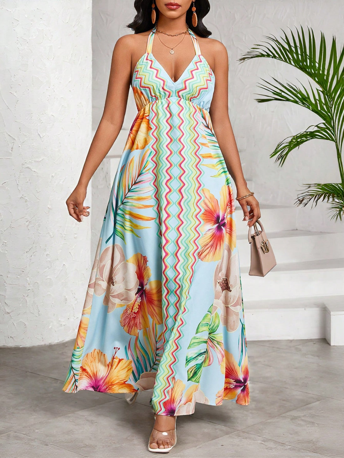 Get ready to make a splash this summer with our Chic Floral Print Halter Dress! Perfect for all your warm weather occasions, from events and vacations to weddings. This dress is both chic and playful, with a fun floral print and a stylish halter design. Don't miss out on this must-have dress!