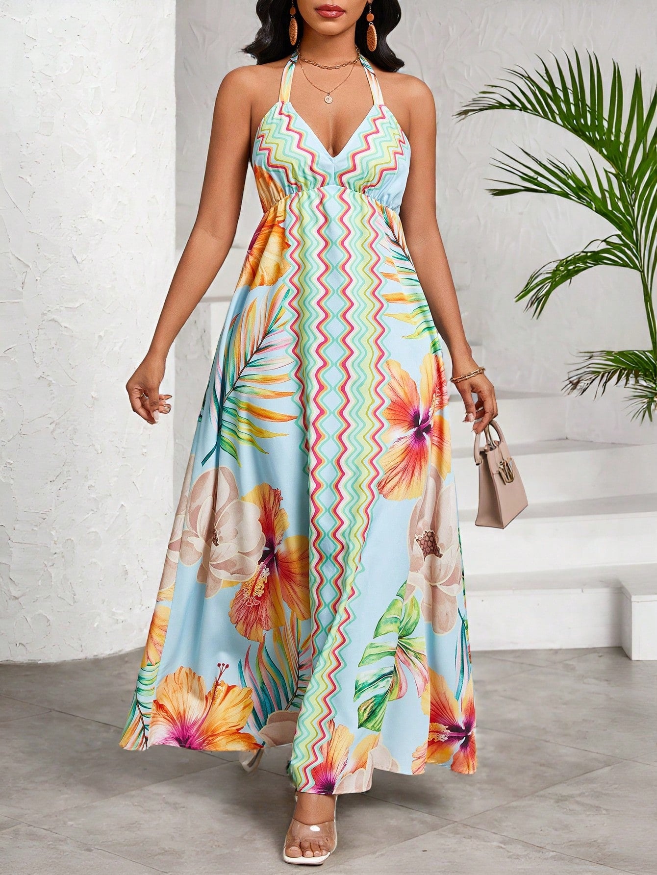 Get ready to make a splash this summer with our Chic Floral Print Halter Dress! Perfect for all your warm weather occasions, from events and vacations to weddings. This dress is both chic and playful, with a fun floral print and a stylish halter design. Don't miss out on this must-have dress!