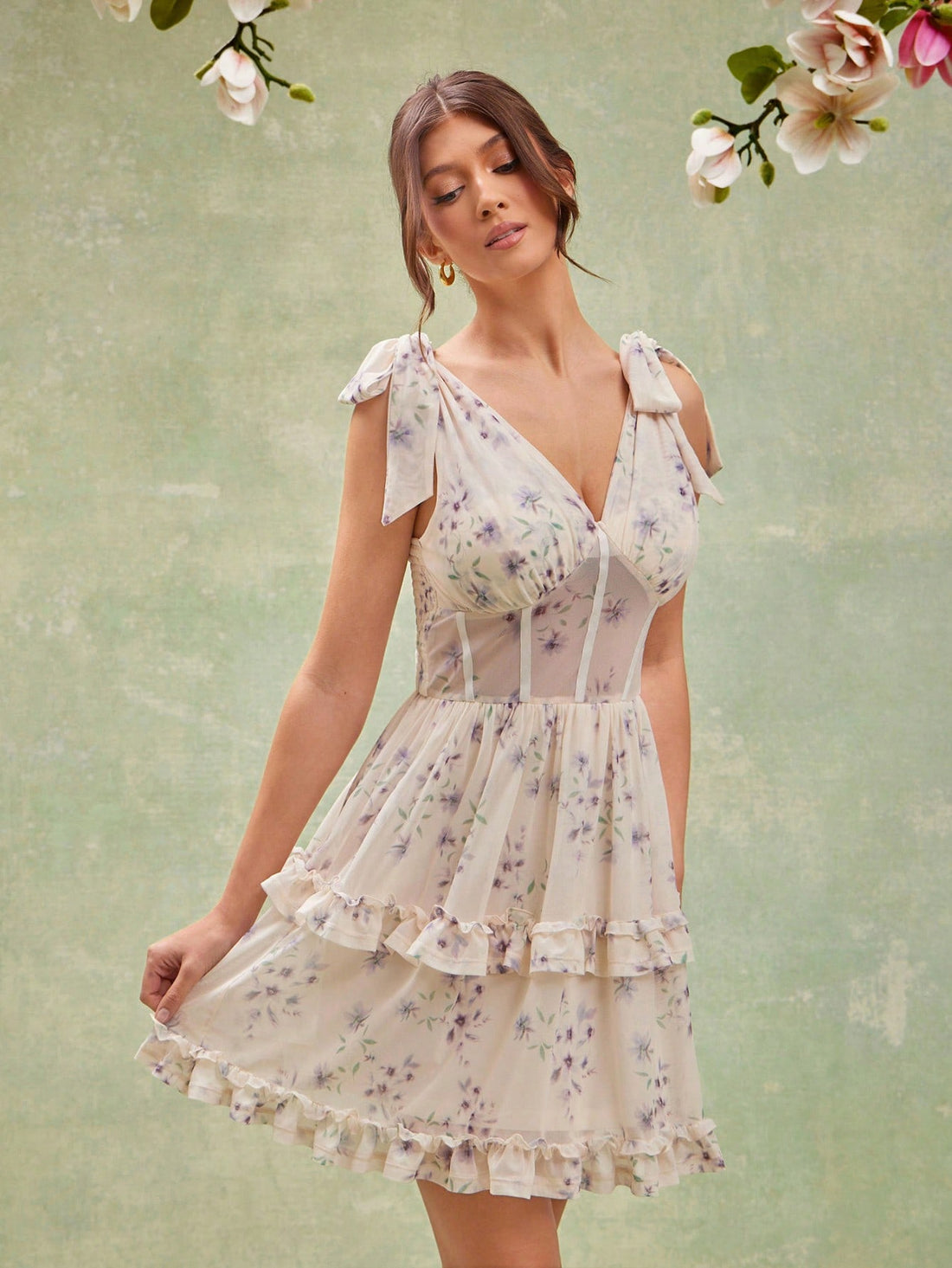 Step into sunny days with this playful sleeveless summer dress, boasting a charming floral print and flirtatious ruffle hem. Lightweight and breezy, it brings effortless style and twirl-ready fun to your warm-weather wardrobe. Perfect for picnics, beach strolls, or casual get-togethers where comfort meets cute.