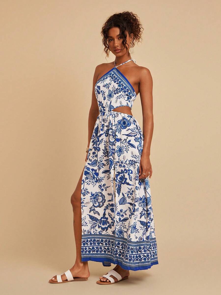 Embrace effortless summer elegance with this stunning floral print halter dress. Featuring a captivating blue and white botanical design, this maxi dress showcases a chic tie-back halter neckline and high-waisted silhouette for a flattering fit. The thigh-high slit and shirred details add movement and dimension, while the sleeveless cami cut keeps you cool and comfortable. Crafted from a breathable woven polyester-elastane blend, this versatile piece transitions seamlessly from casual outings to special occ