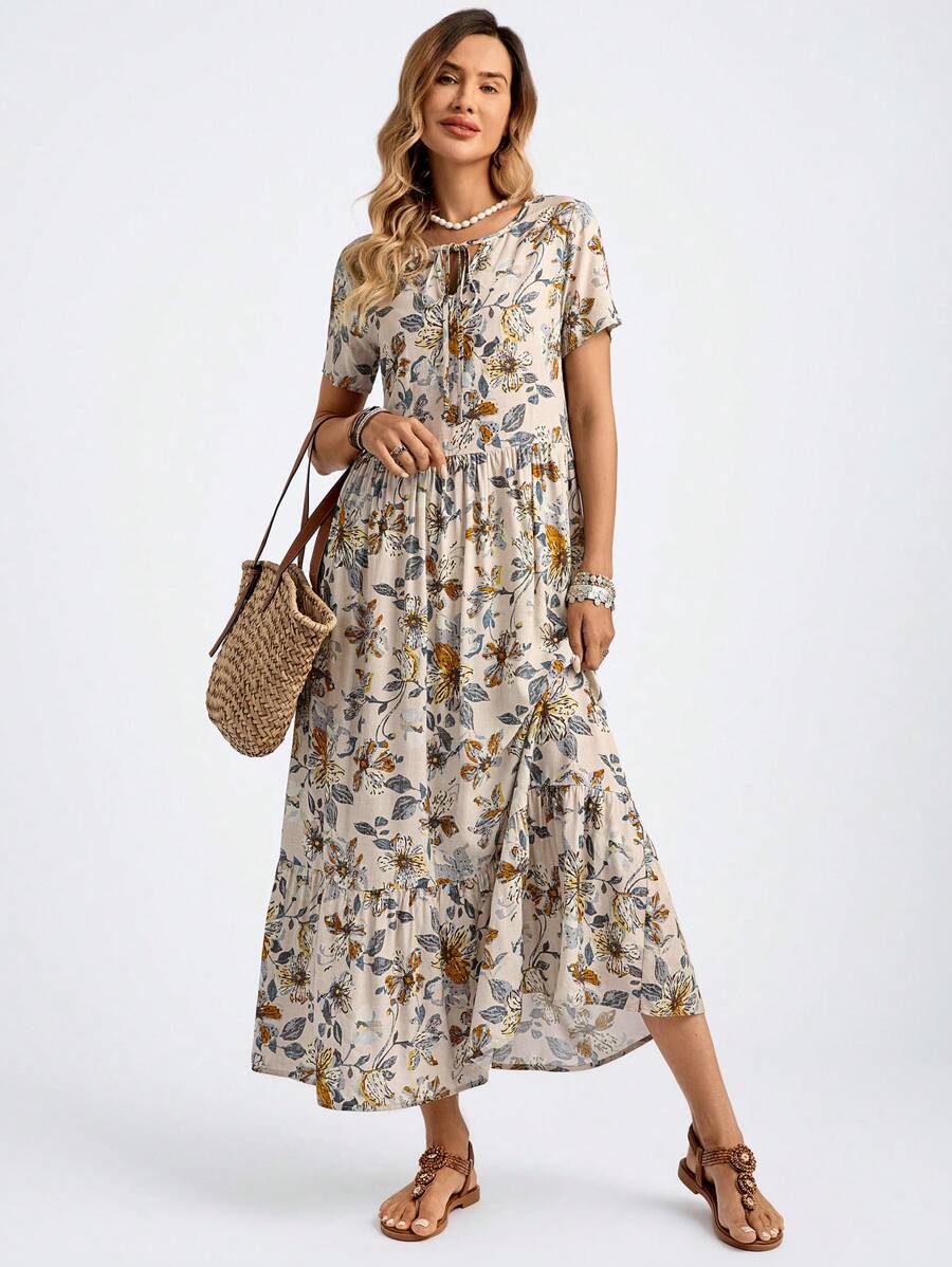 Effortlessly channel summer vibes with our Chic Floral Print Tie Neck Ruffle Hem Cover-Up Dress. The playful floral design, tie neck, and ruffle hem add a touch of quirkiness to your wardrobe. Perfect for any summer occasion, this dress will have you looking chic and feeling stylish.