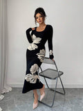 Front full view of black and cream floral square-neck bodycon knit midi dress with long sleeves