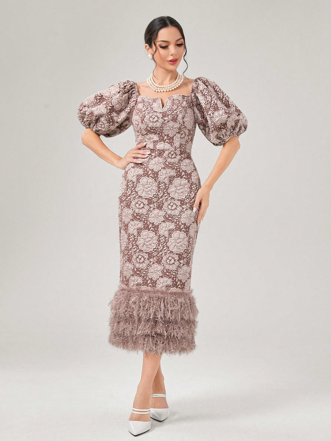 Enhance your spring wardrobe with this Chic Floral Puff Sleeve Dress. The eye-catching print and puff sleeves add a flirty touch, while the fuzzy hem provides a unique and stylish detail. Perfect for any occasion, this dress is sure to make you stand out in a chic and fashionable way.