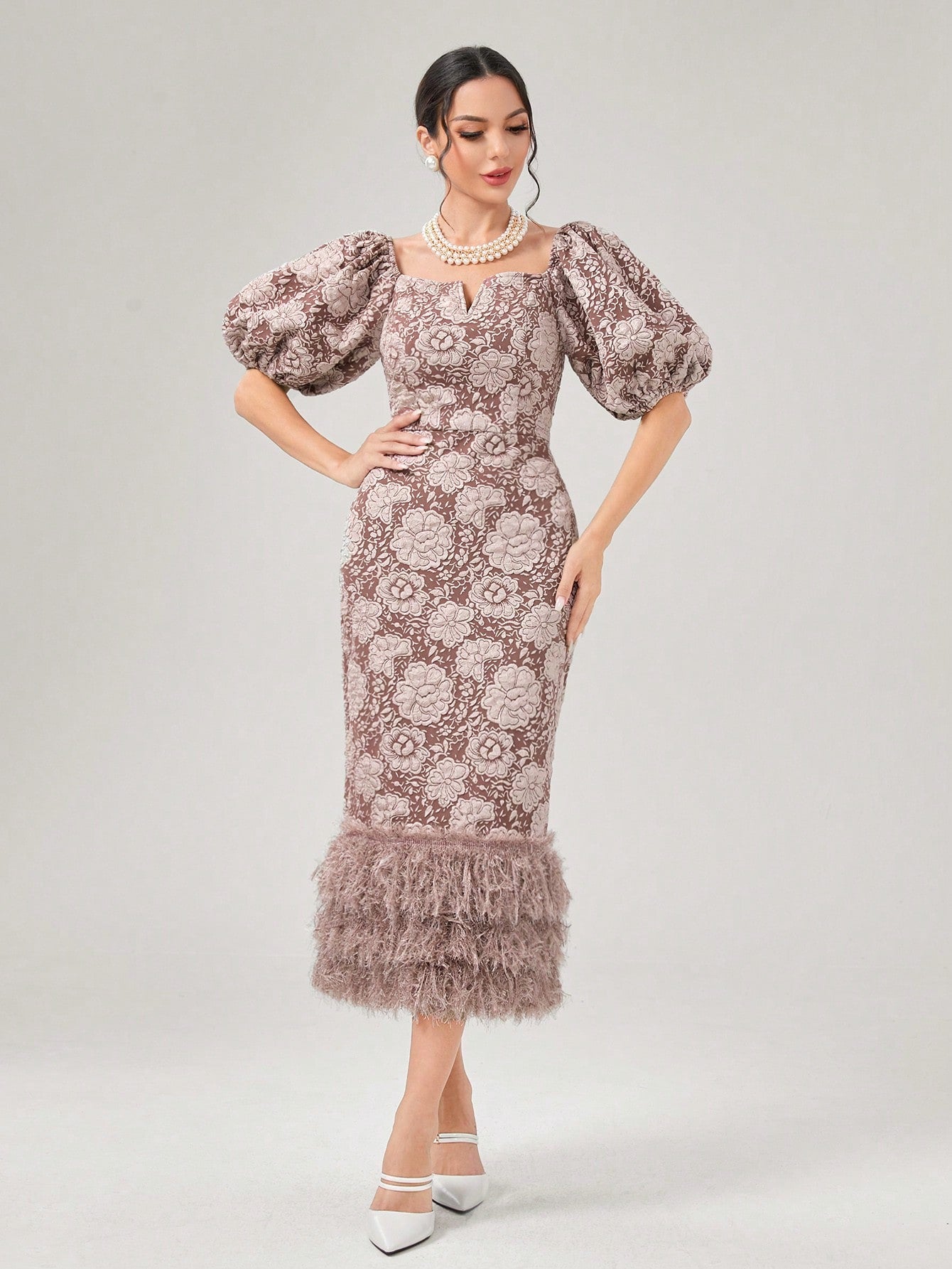 Enhance your spring wardrobe with this Chic Floral Puff Sleeve Dress. The eye-catching print and puff sleeves add a flirty touch, while the fuzzy hem provides a unique and stylish detail. Perfect for any occasion, this dress is sure to make you stand out in a chic and fashionable way.