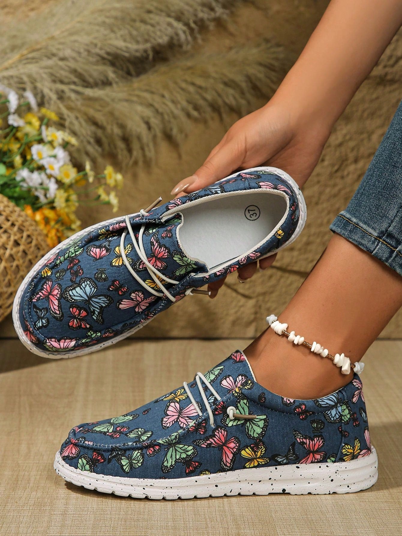 Introducing our Chic Floral Slip-On Shoes, inspired by European and American style. With a sleek and modern design, these shoes are perfect for any fashion-forward individual looking to add a touch of sophistication to their wardrobe. Step into style and embrace the best of both worlds with these slip-ons!