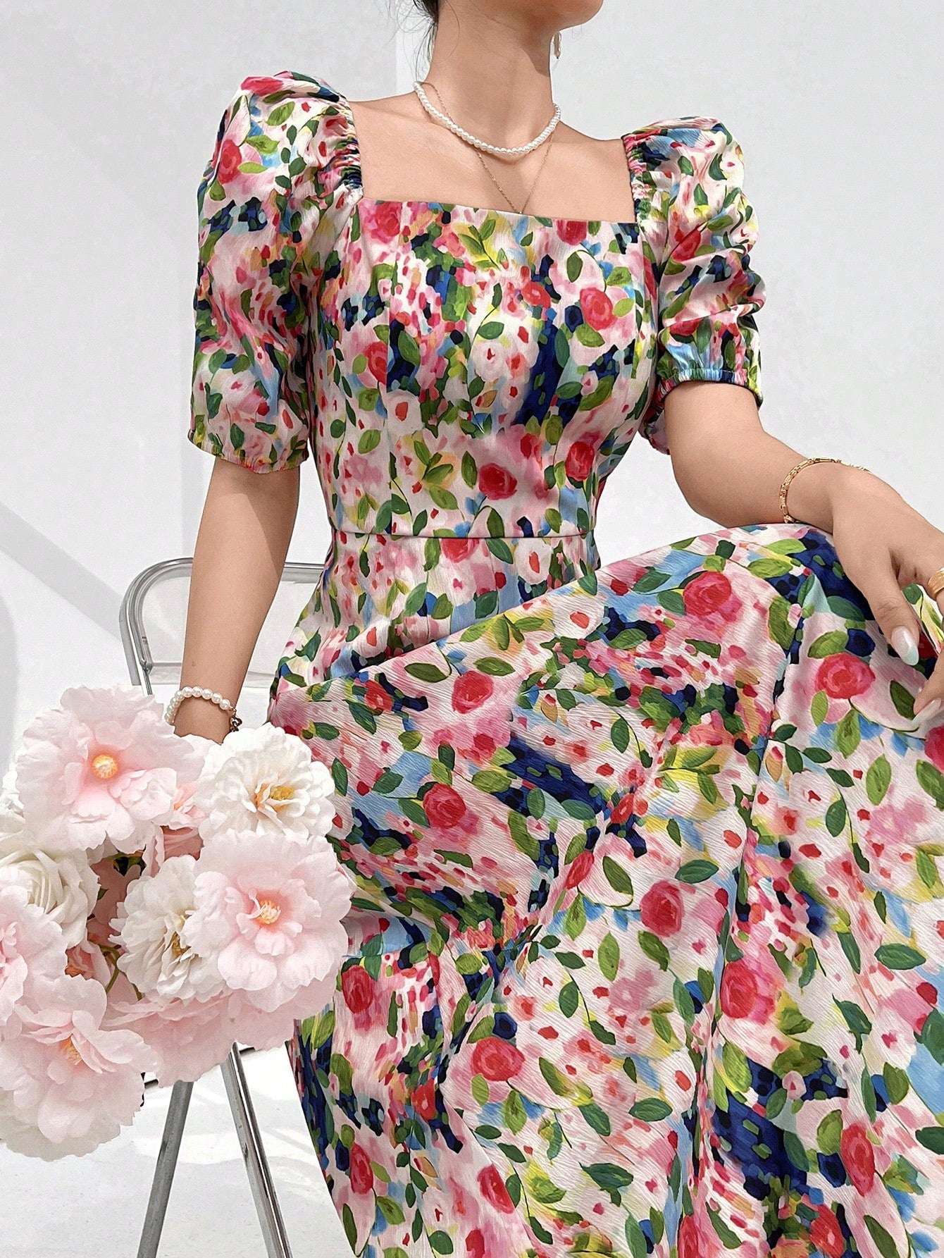 Elevate your holiday style effortlessly with our Chic Floral Square Neck Casual Dress. The dress boasts a square neckline and a beautiful floral print, bringing a touch of sophistication to your look. With its versatile and comfortable design, it's perfect for any occasion. Transform any holiday outing into a fashion statement with this stylish dress.