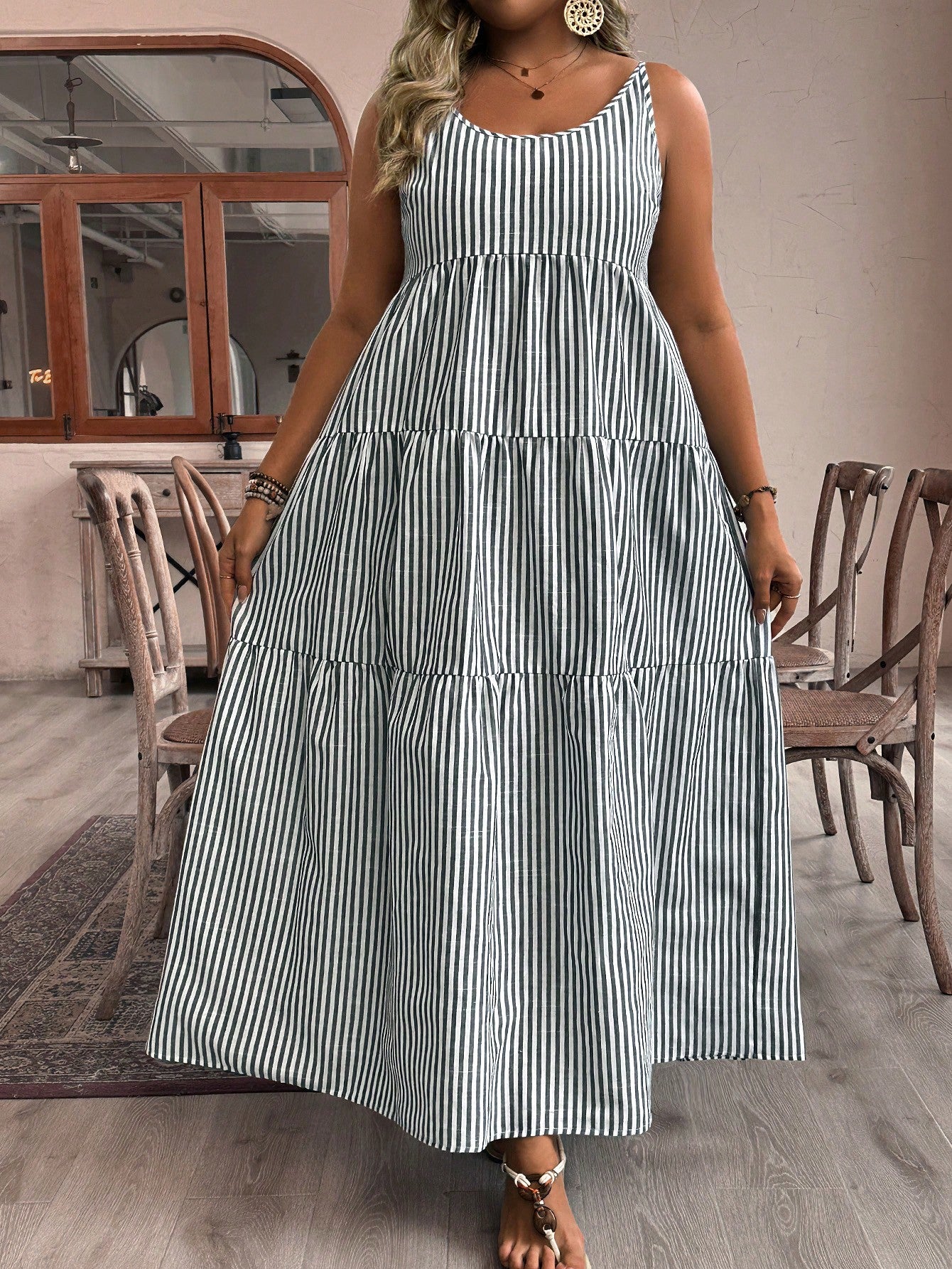 Get ready to strut your stuff in this Chic & Flowy Plus Size Striped Ruffle Hem Cami Dress. With its eye-catching stripes and playful ruffle hem, this dress is sure to turn heads. The flowy fit and comfortable fabric make it perfect for any occasion. Time to dress to impress (and have some fun)!