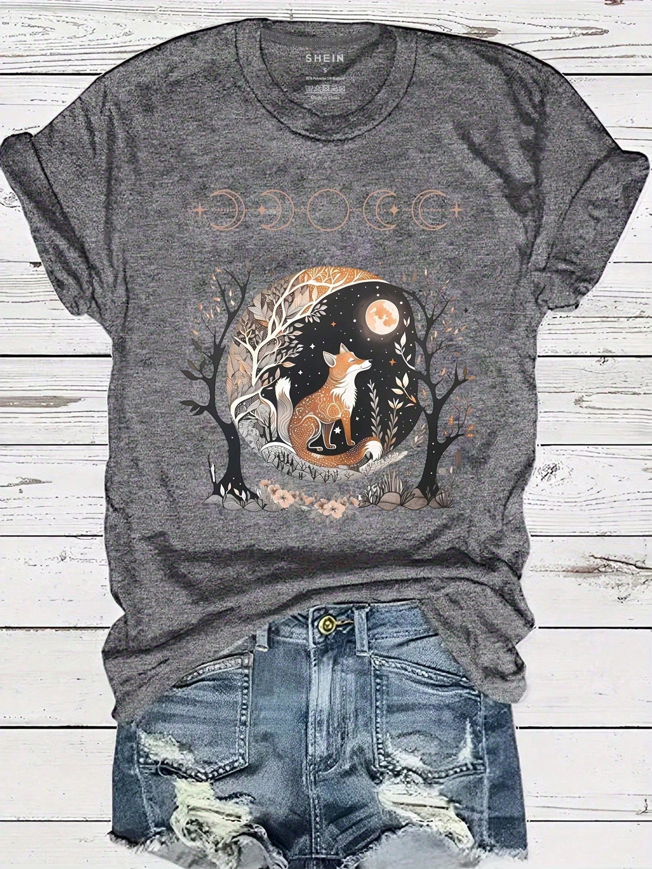Roam the streets in style with our Chic Fox Graphic Tee for Women. This trendy and stylish casual top features a charming fox design, making it a playful addition to any outfit. Embrace your inner fashionista and turn heads with this must-have tee!