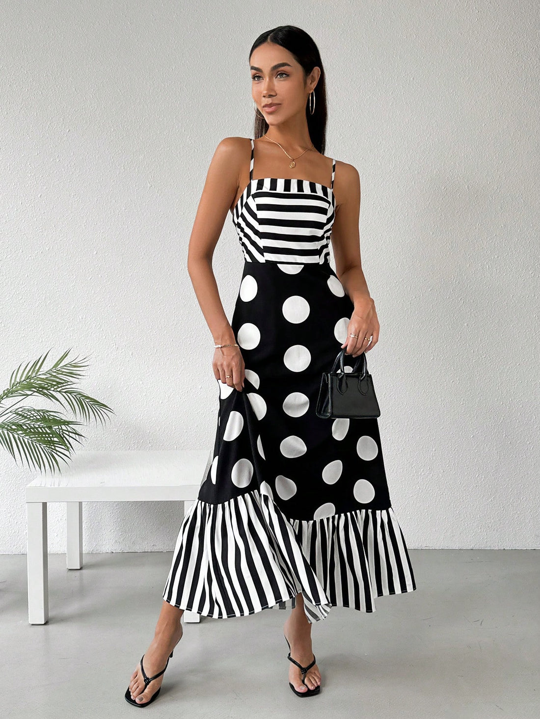 Embrace Parisian vibes with our Chic French-Style Cami Dress! Featuring striped and polka dot splicing, this dress adds a playful twist to the classic cami style. Perfect for spring and summer, this dress will have you looking effortlessly stylish. Bonjour, fashionista!