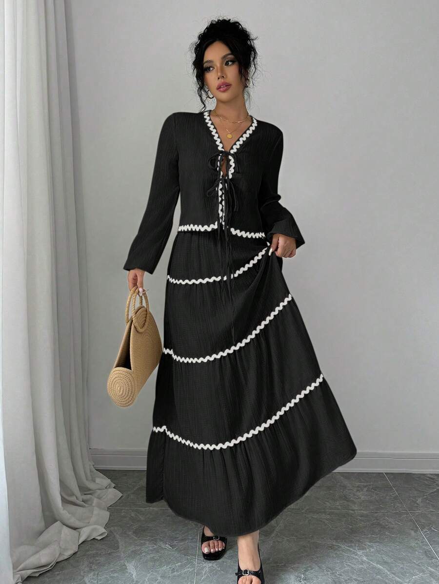 Elevate your autumn wardrobe with this charming two-piece set that brings effortless elegance to every occasion. The blouse features romantic lantern sleeves with delicate ruffles that add movement and dimension, while the coordinating skirt completes the look with timeless sophistication. Perfect for brunch dates, casual gatherings, or whenever you want to feel polished without trying too hard. This French-inspired ensemble captures that coveted je ne sais quoi—think Parisian chic meets playful femininity.