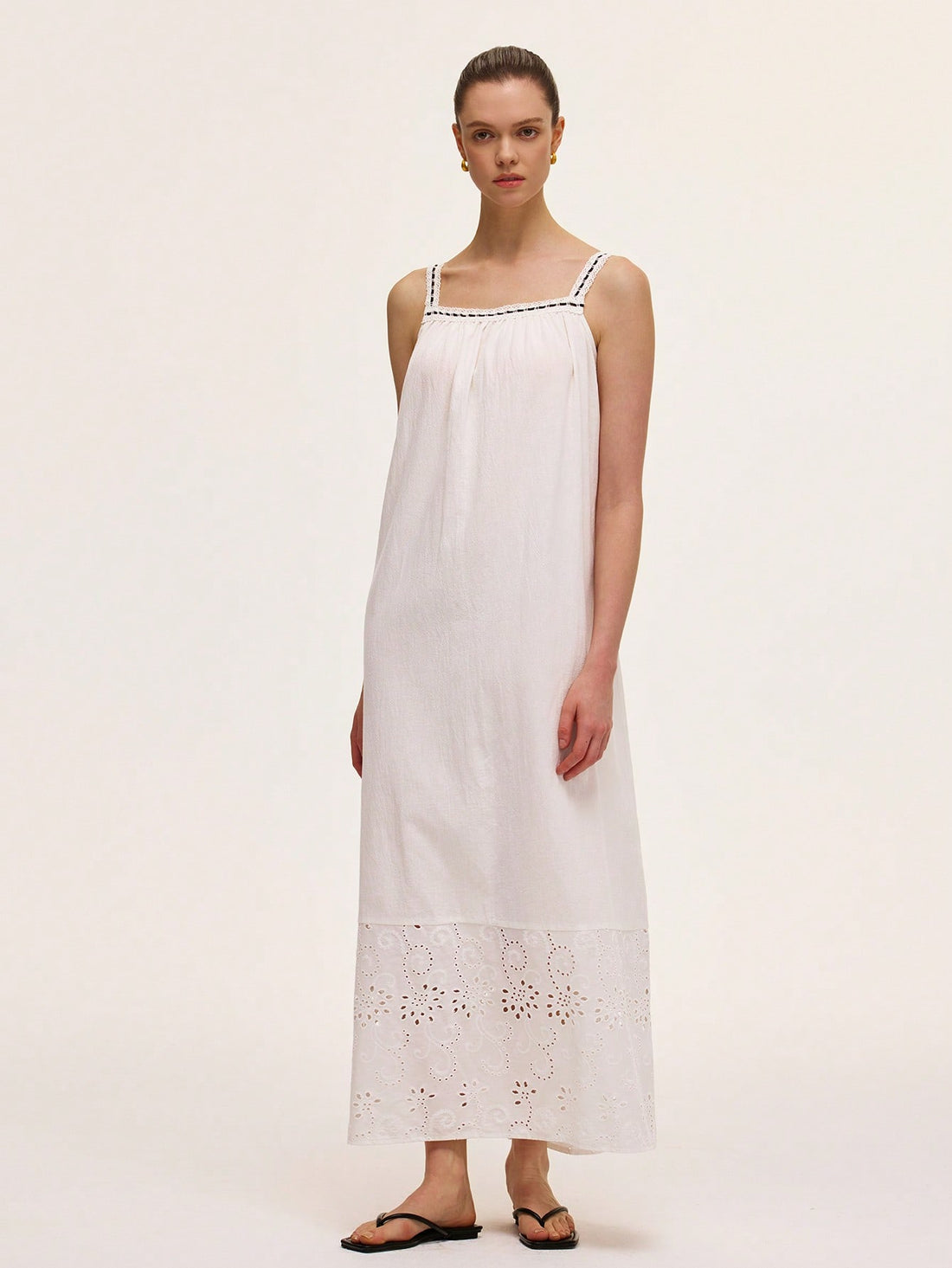 Embrace your inner French girl with this playful embroidered spaghetti strap dress! Perfect for twirling through cobblestone streets or sipping rosé at sunset, this retro-inspired piece brings effortless chic to your holiday wardrobe. Just add oversized sunglasses and a wicker basket bag for that je ne sais quoi that'll have everyone asking, "Where did you get that dress?"