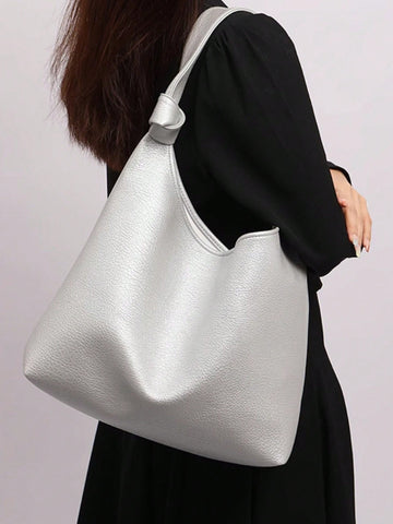 This chic French retro shoulder bag is the perfect accessory for any stylish woman. With its spacious design, it offers both style and functionality. Made with high-quality materials, this tote is both durable and fashionable. Elevate your wardrobe with this must-have bag.