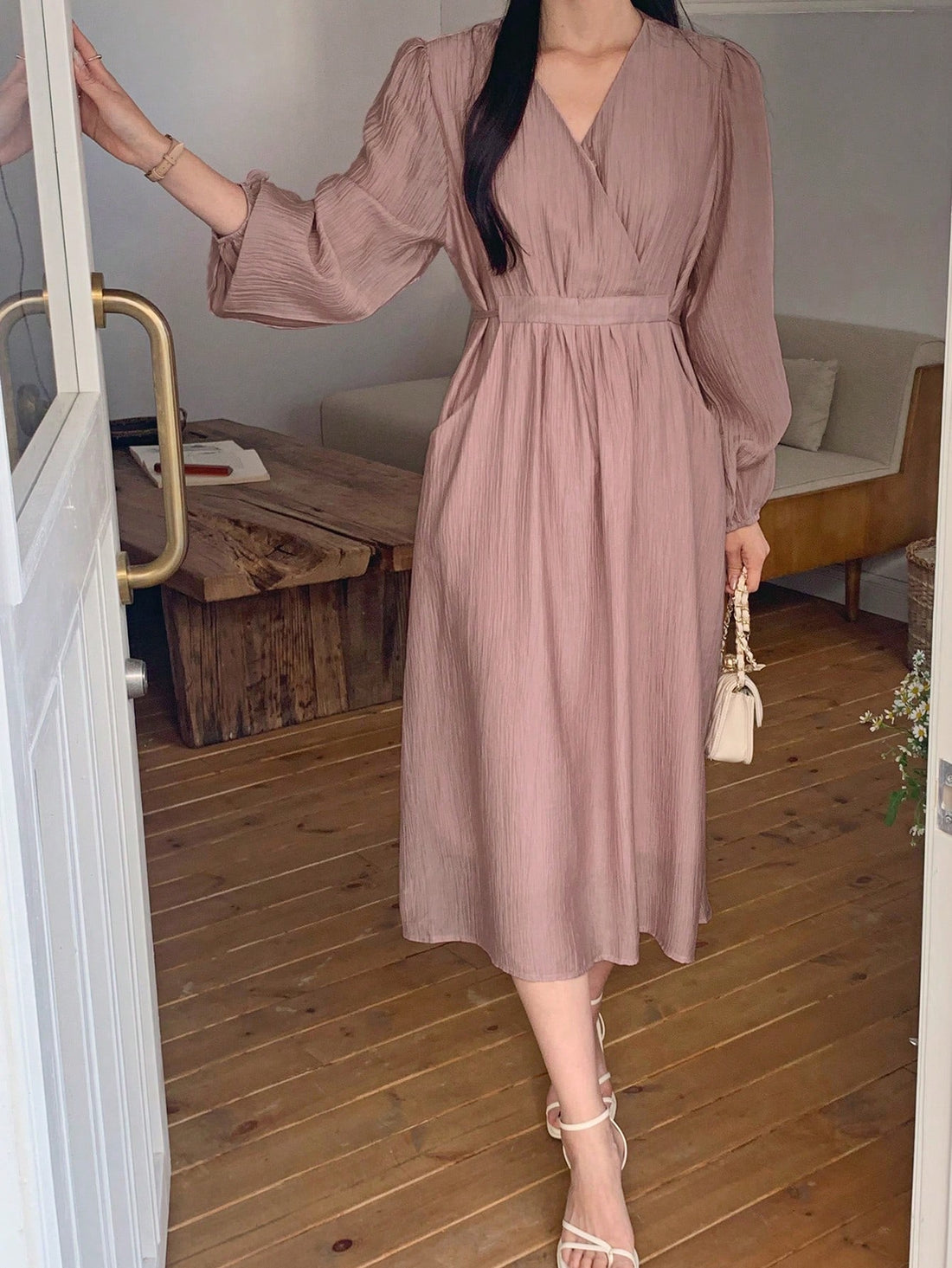 Experience a chic and playful vibe with our Gathered Mid-Length Dress. The cinched waist and v-neckline add a touch of elegance, while the gathered details provide a unique and flattering silhouette. Dress it up or down for a versatile and stylish look.
