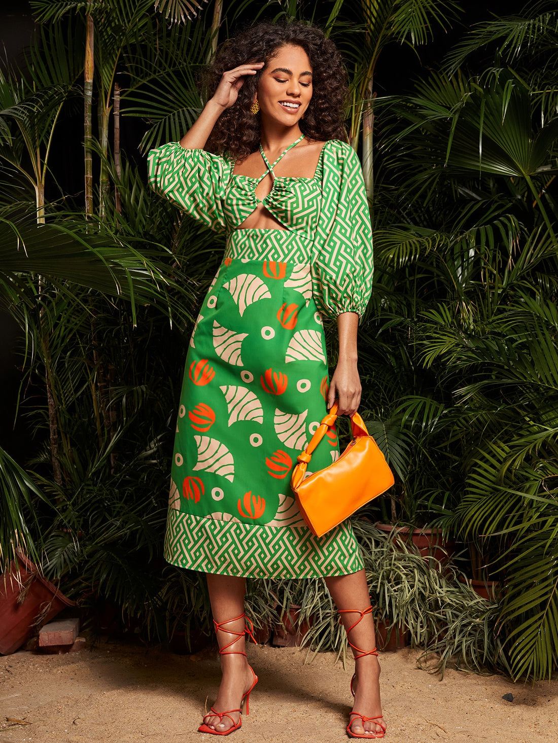 This chic Geo-Print Cut-Out Lantern Sleeve Dress is perfect for any occasion. The unique design and cut-outs add a touch of elegance and style. Made with high-quality fabric, it provides comfort and durability. A must-have for any fashion-forward individual.